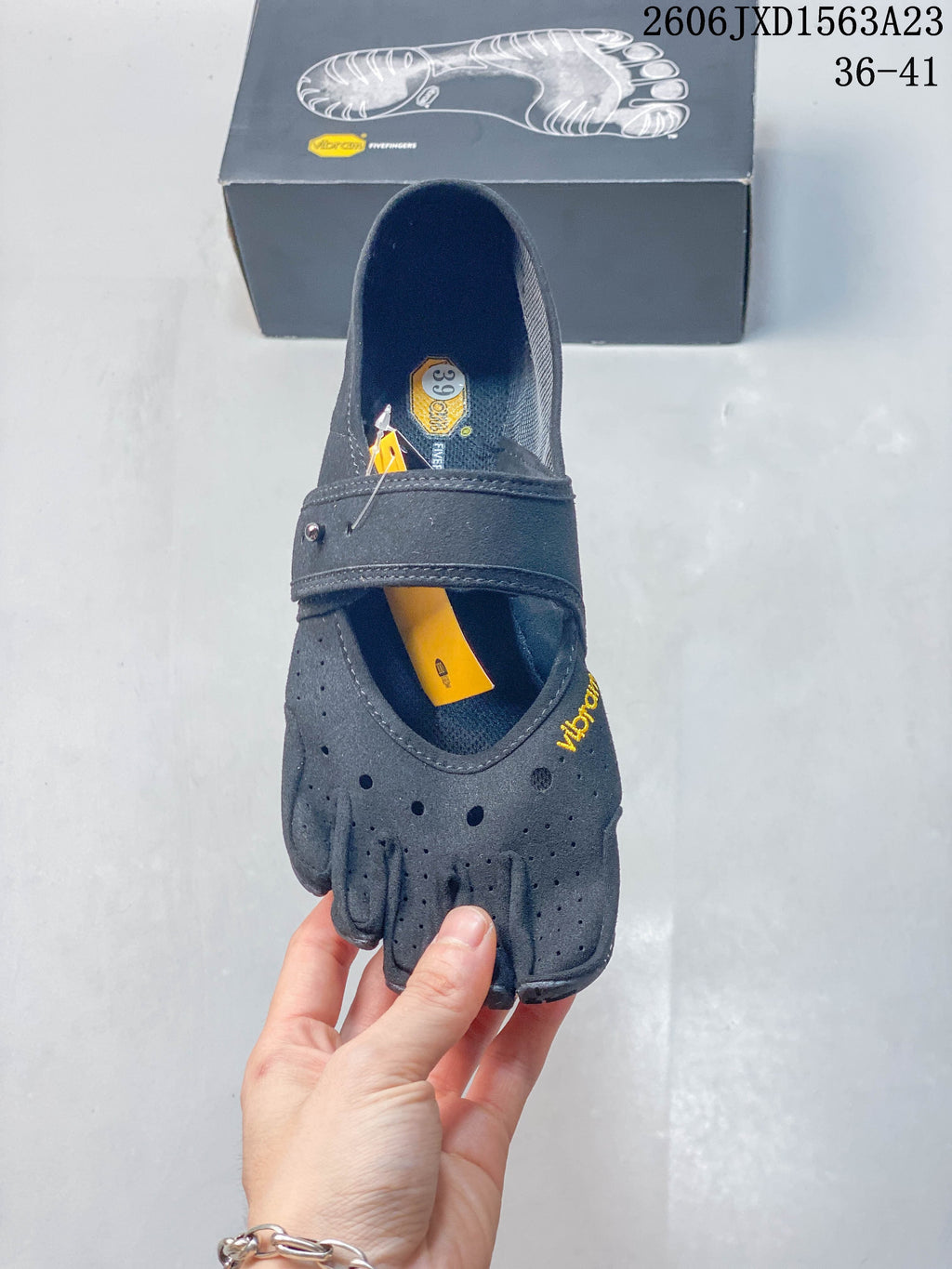 Top view showing the individual toe compartments and size label inside a gray shoe