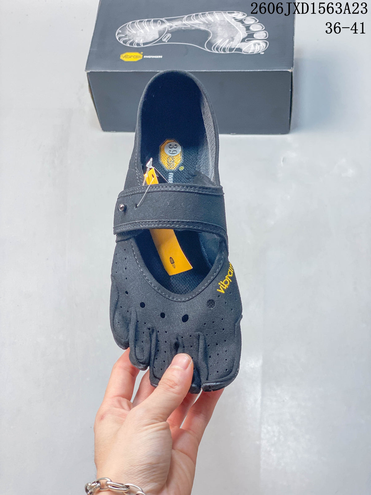 Top view showing the individual toe compartments and size label inside a gray shoe