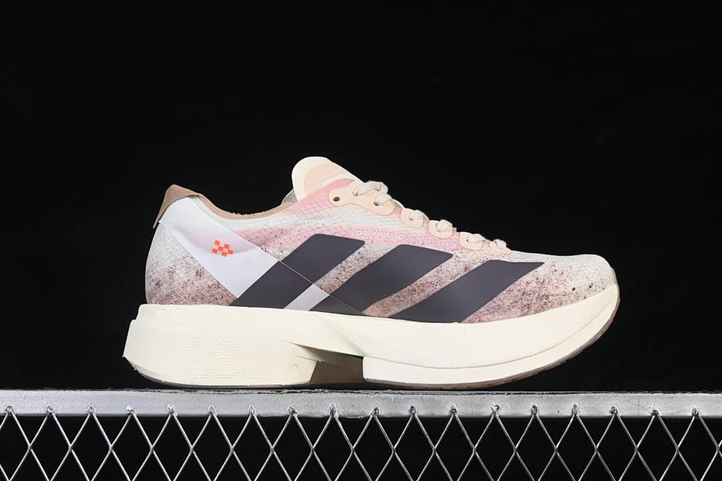 Side profile showing the patterned upper, dark stripes and thick cream-colored sole
