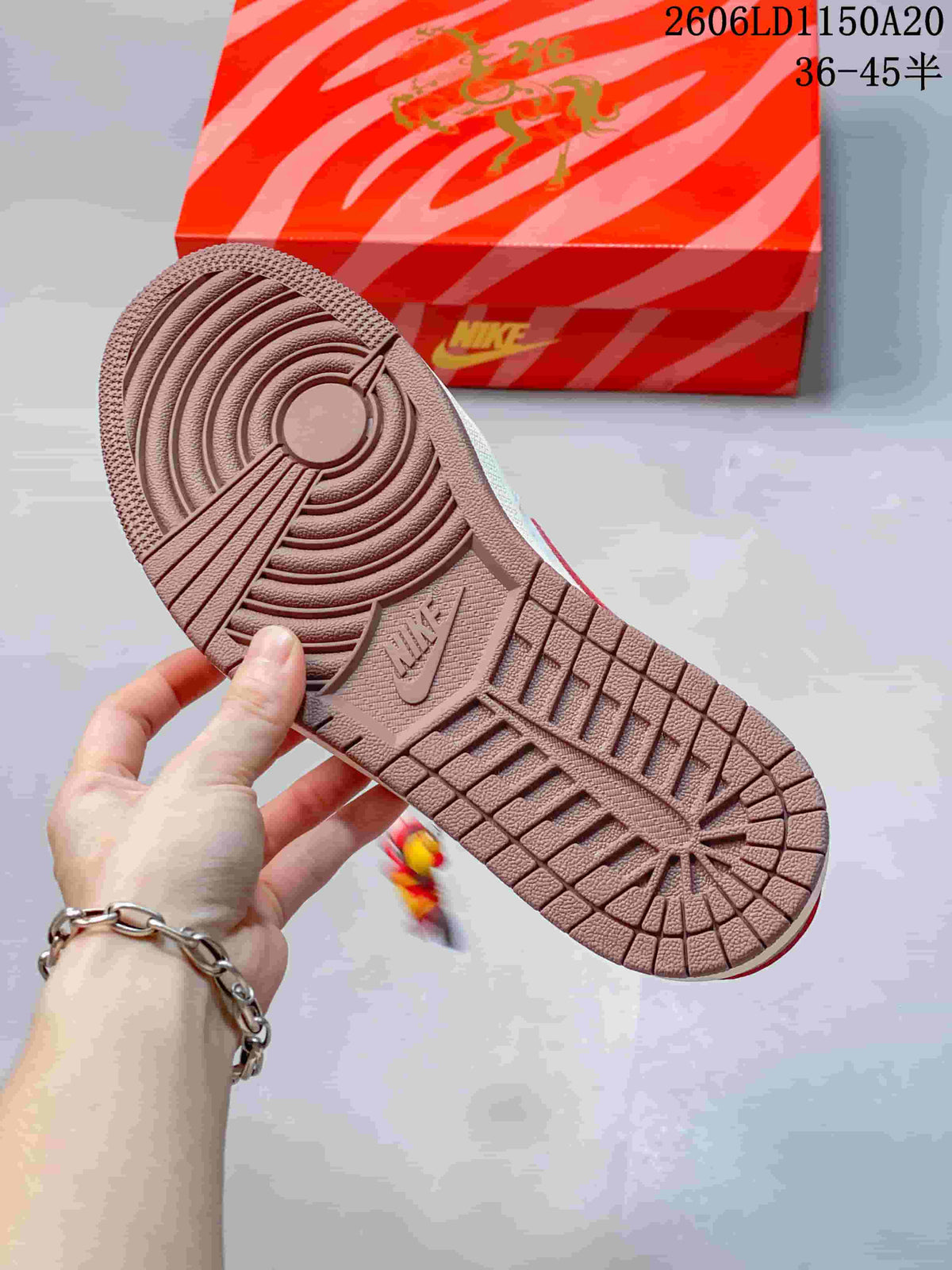 Close-up of the textured brown outsole of the low-top sneaker.