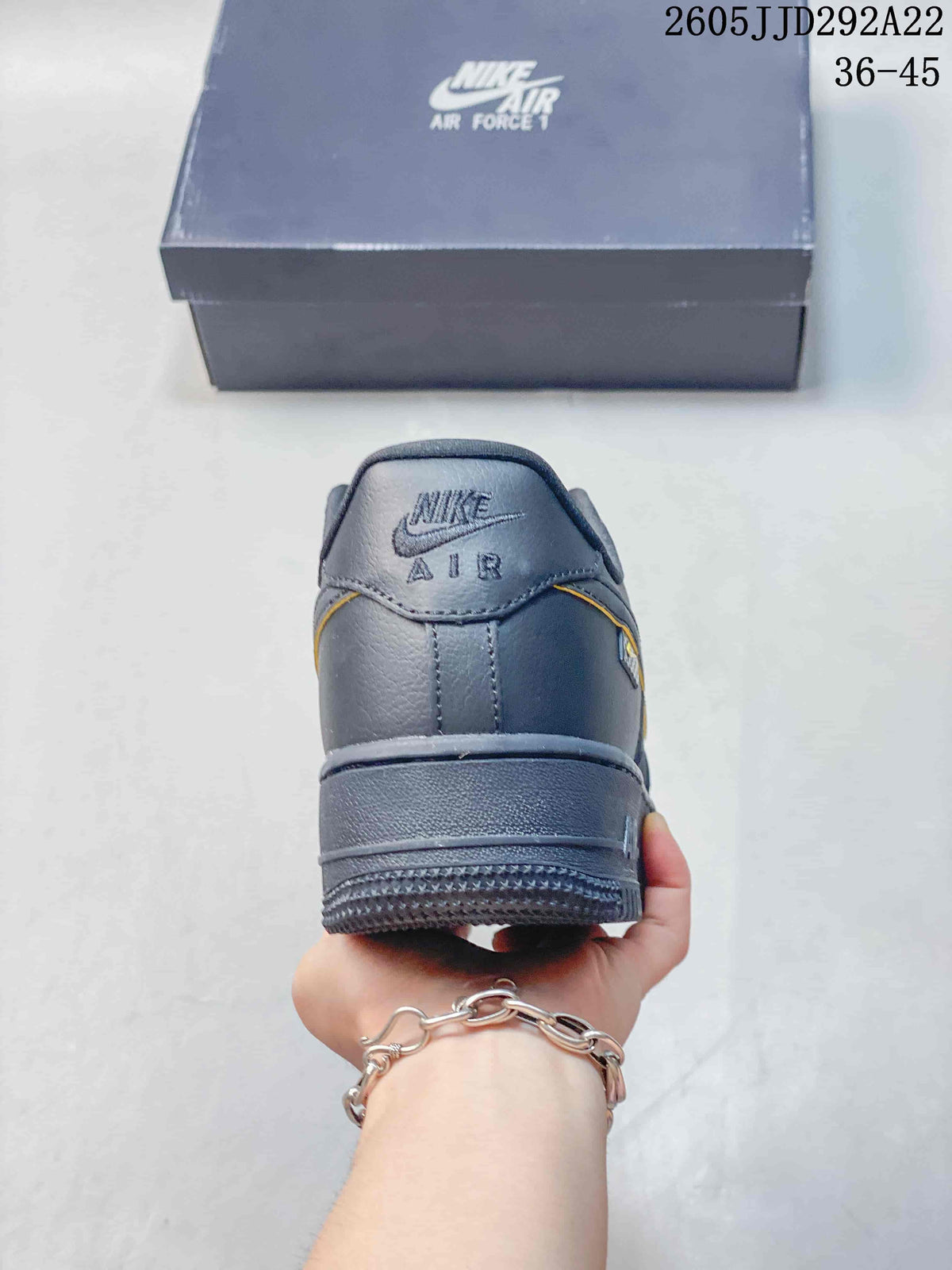 Rear view of the gray sneaker showing the heel and layered sole