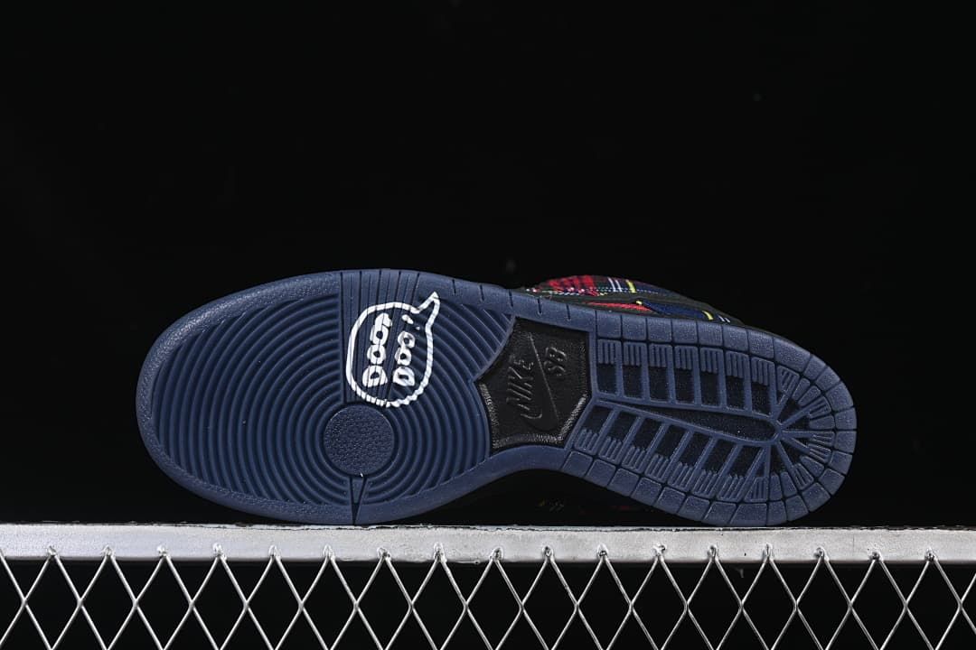 Outsole view showing tread pattern and a graphic near the heel.
