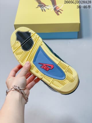 Outsole view with yellow tread and a blue midfoot section