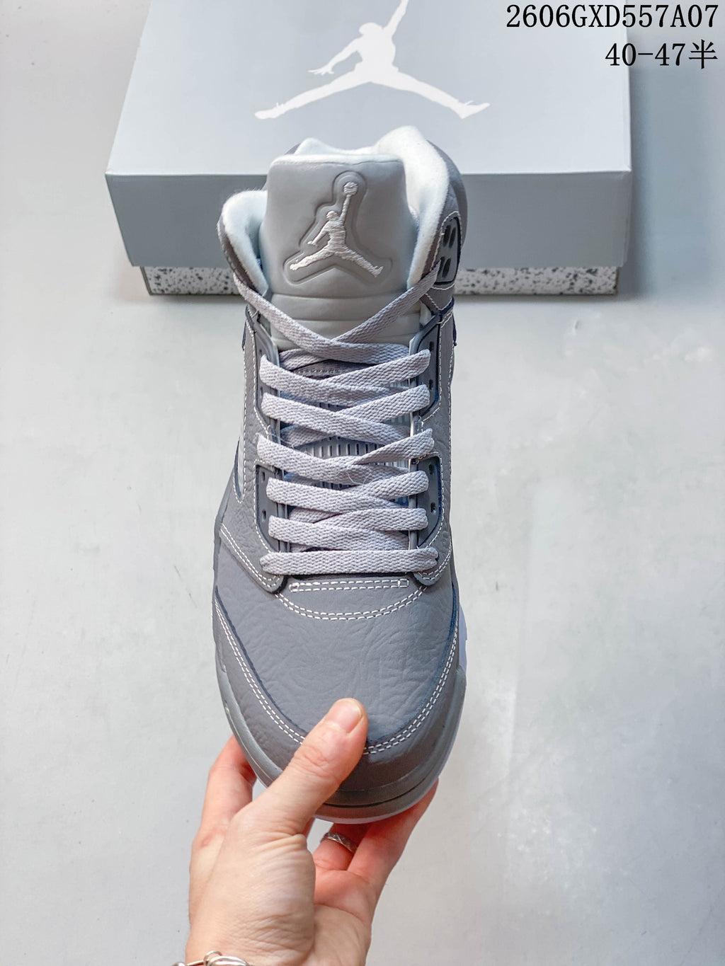 Front view of the gray high-top sneaker with white laces