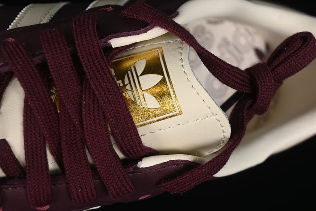 Close-up of the tongue label and burgundy laces