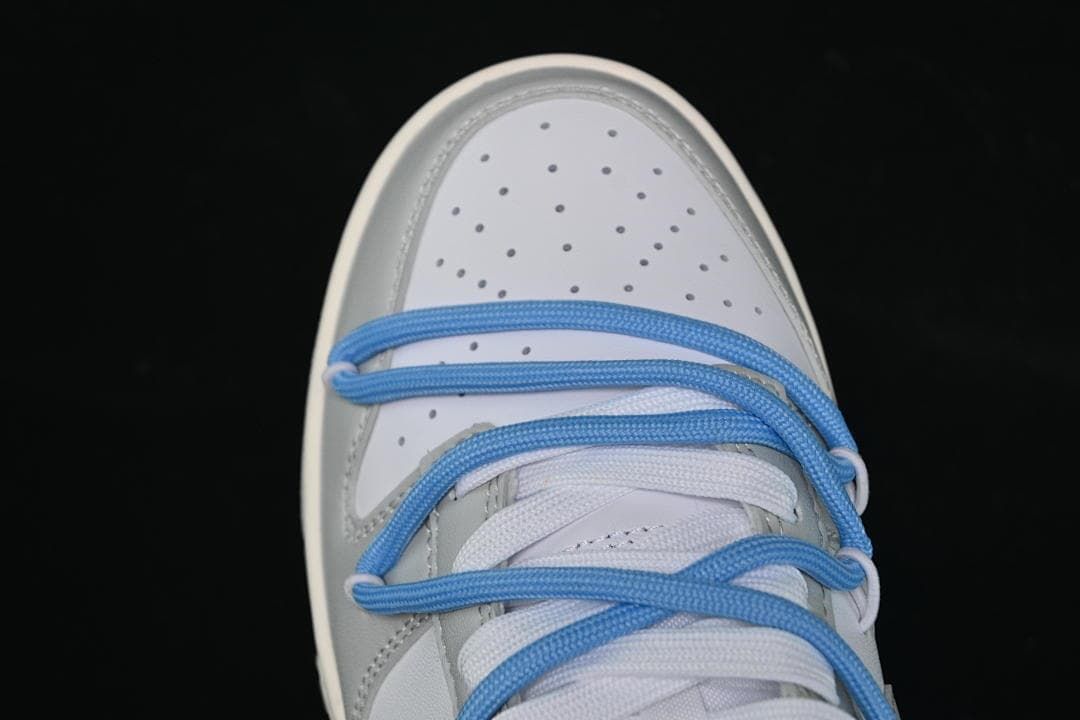 Top-down view of the perforated toe and blue overlay laces