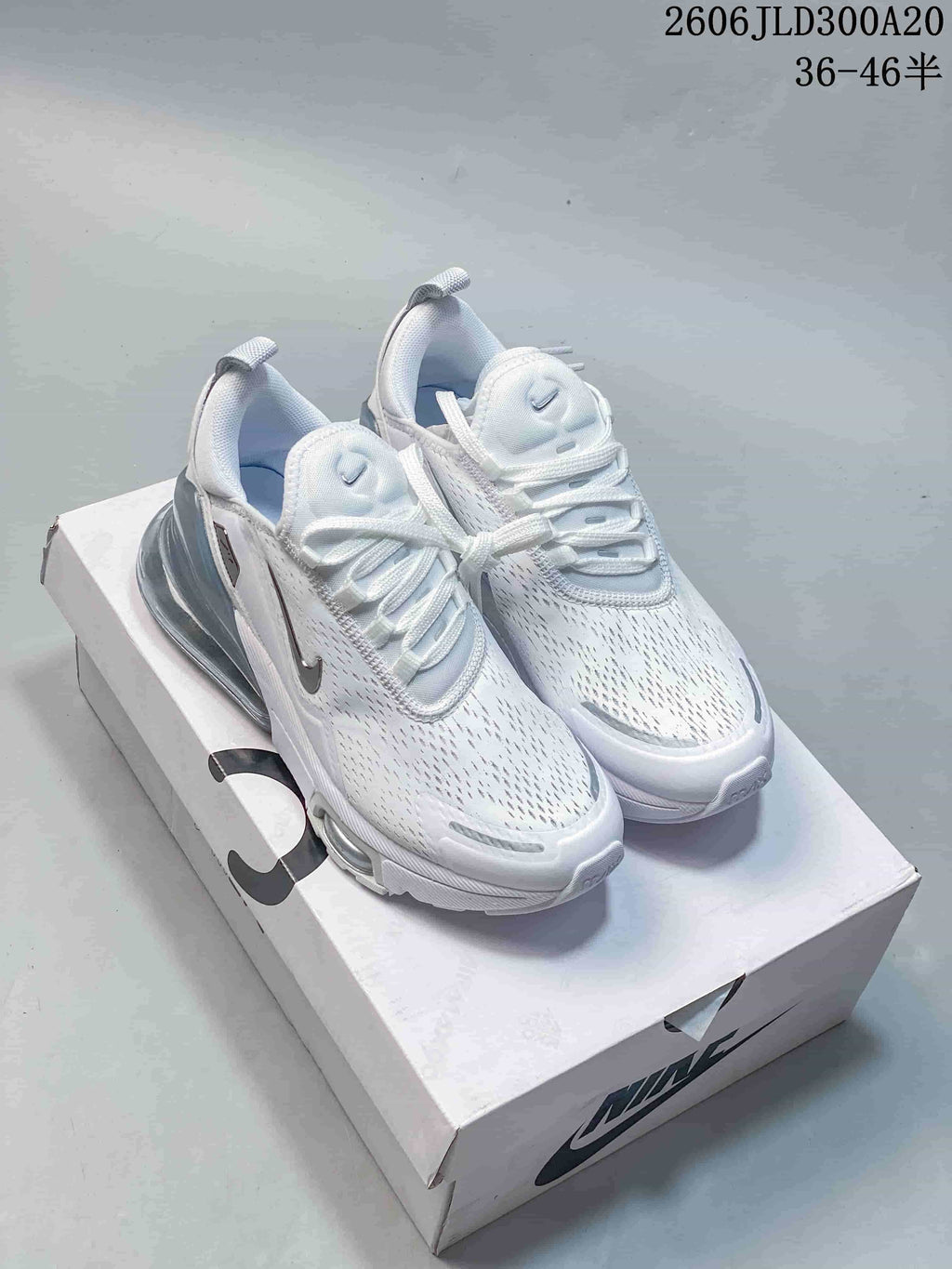 Pair of white Nike Air Max 270 Premium sneakers with light blue-gray heel units