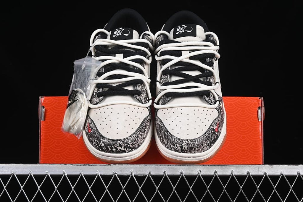 Front view of the pair showing the patterned toe overlays and contrasting laces