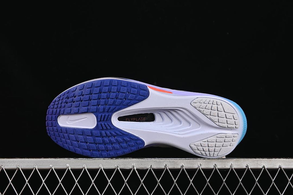 Outsole view showing the tread pattern and central plate area.