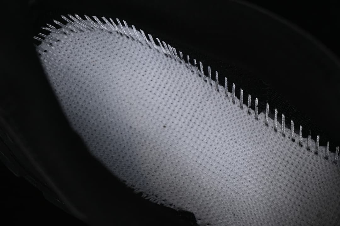 Close-up of the textured underside of a shoe insole