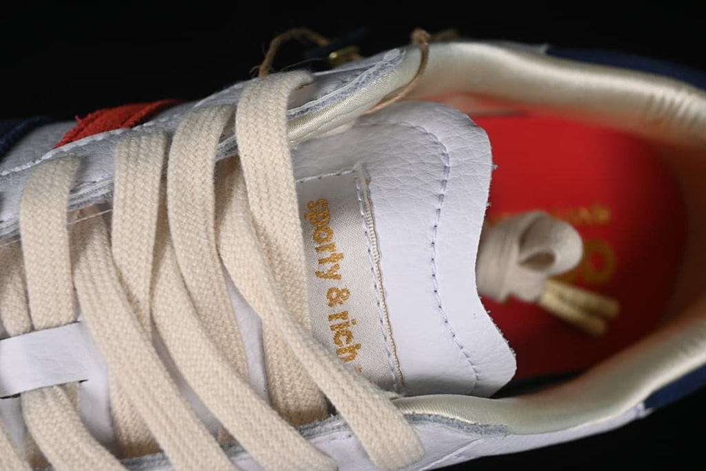 Close-up of the cream laces and Sporty & Rich tongue label