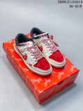 Pair of cream and red low-top sneakers with patterned laces, displayed on a red decorative box