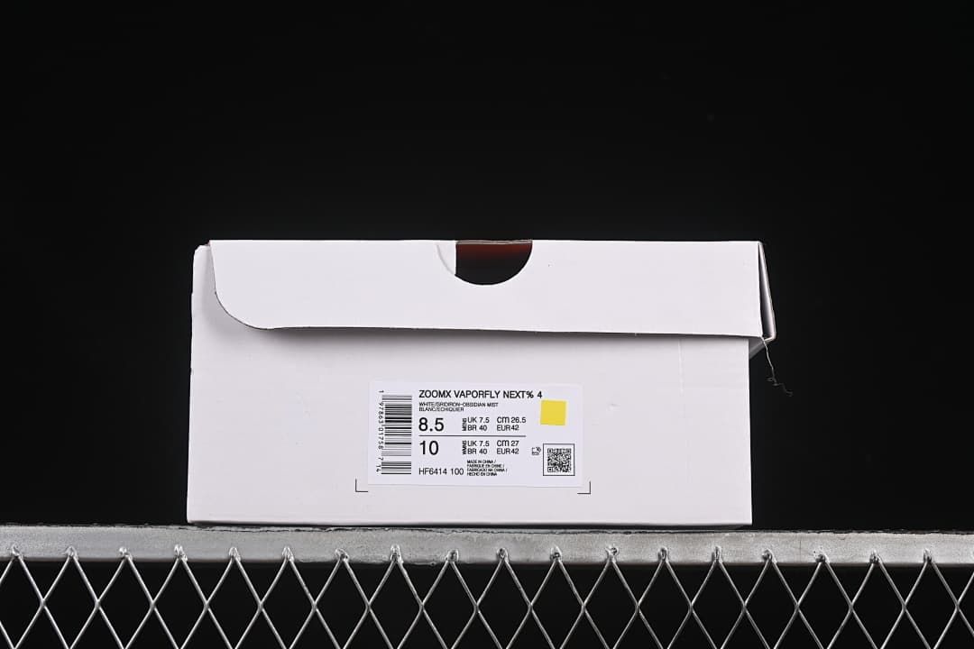 Shoe box label identifying ZoomX Vaporfly NEXT% 4, style HF6414-100, and sample size markings.