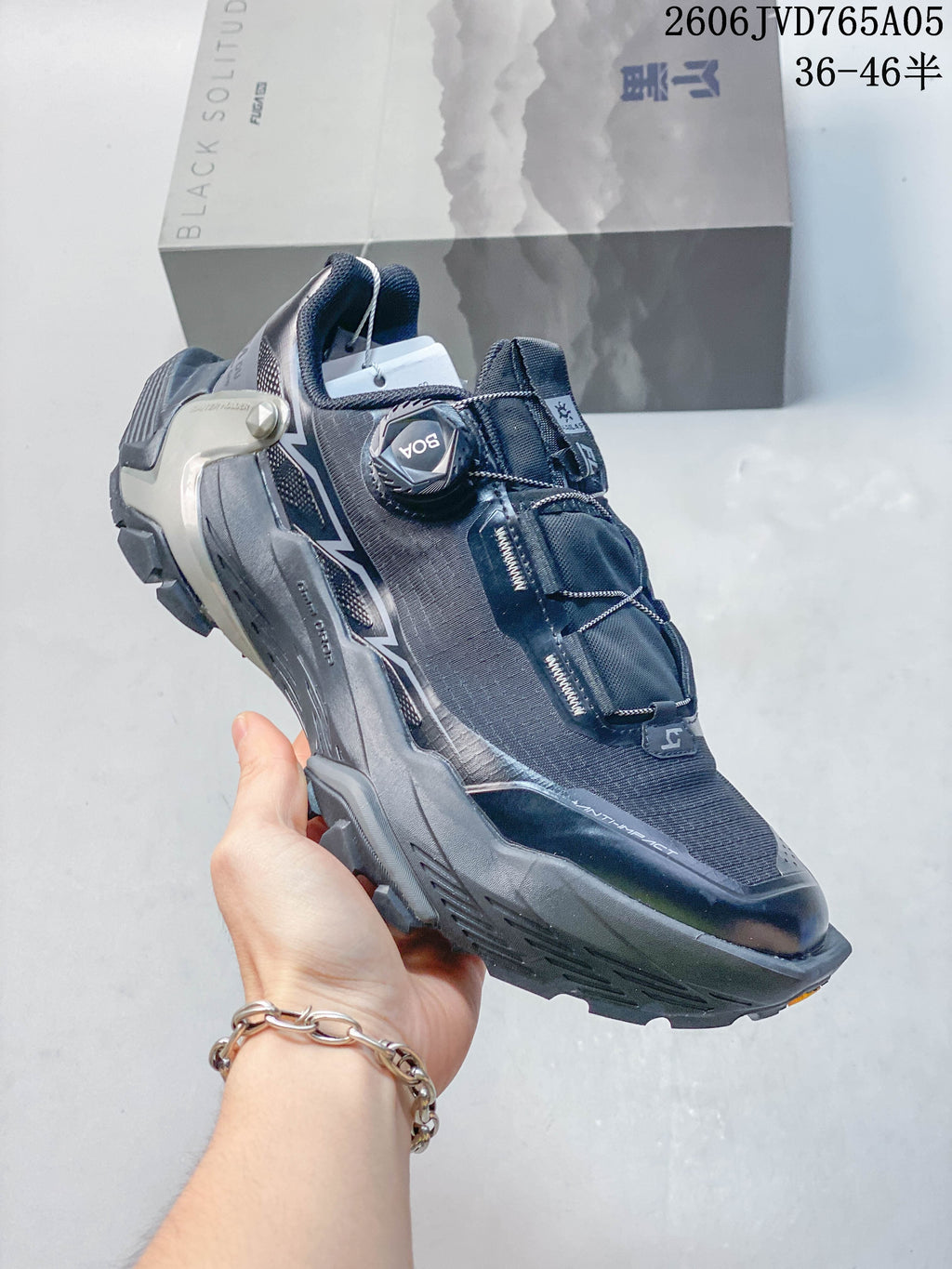 Angled side view of the trail shoe highlighting its BOA dial, upper, heel support, and lugged sole.