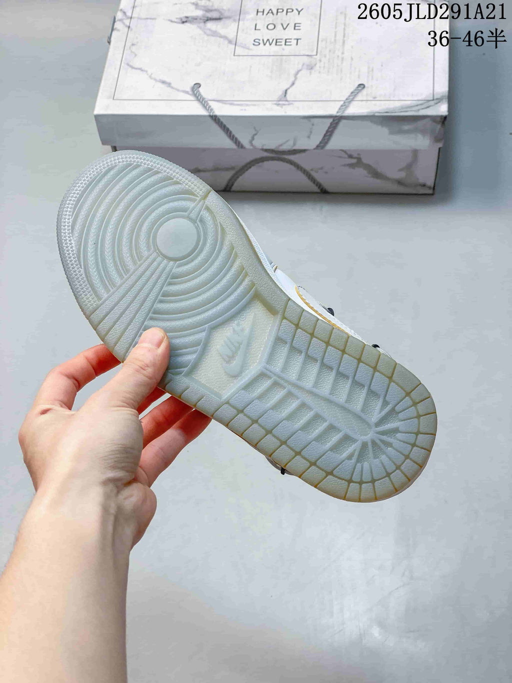 Close-up of the light grey outsole and circular tread pattern