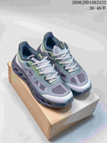 Pair of gray and lime On Cloudtilt Remix sneakers shown from above on a shoe box.