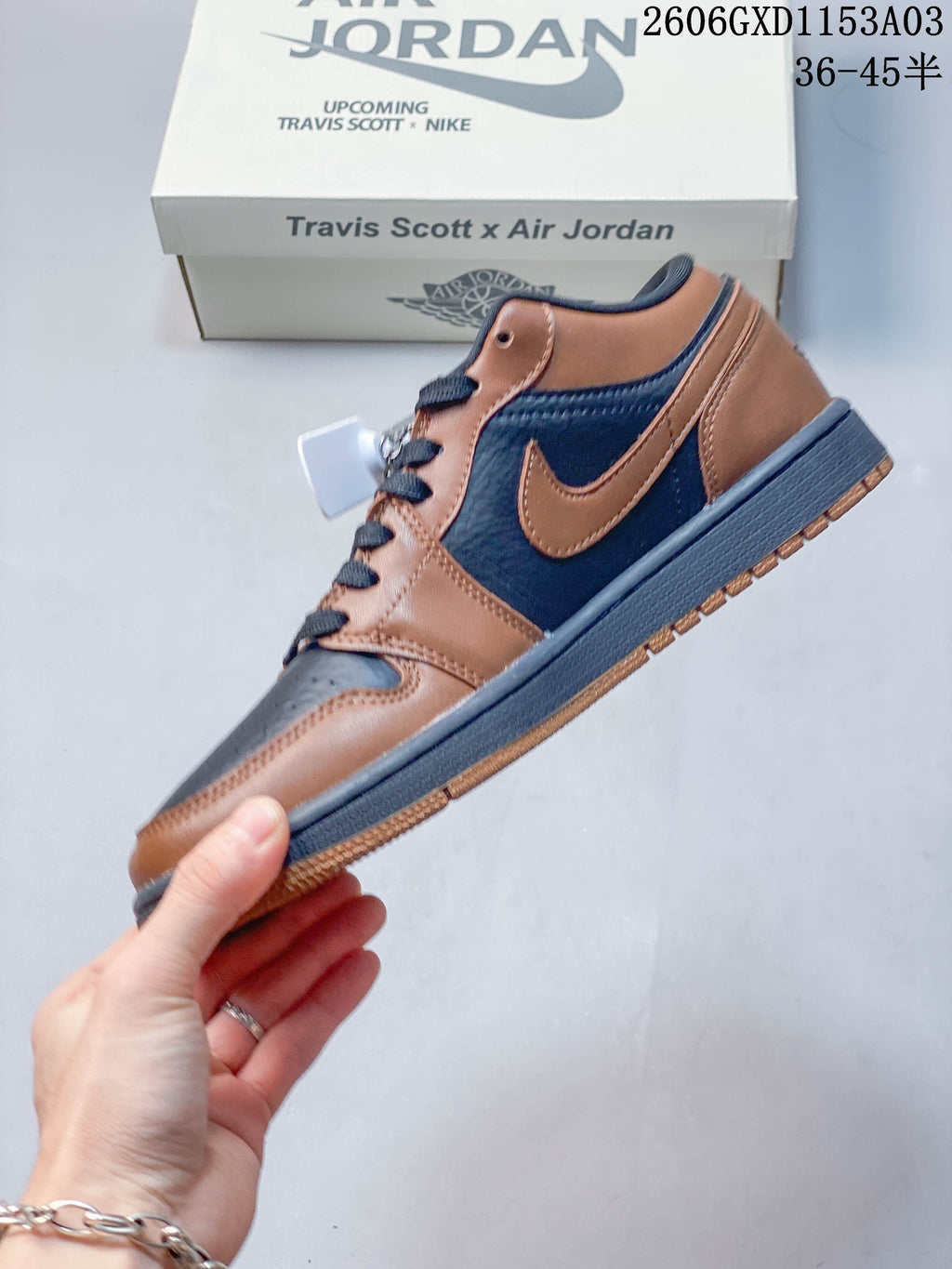 Side profile of brown and dark navy low-top sneakers