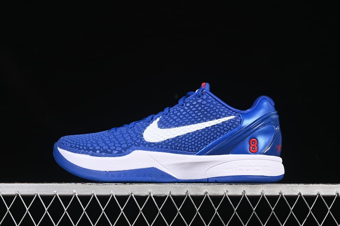 Side view of blue Nike Kobe VI Protro basketball shoe with white Swoosh and red number 8 accent