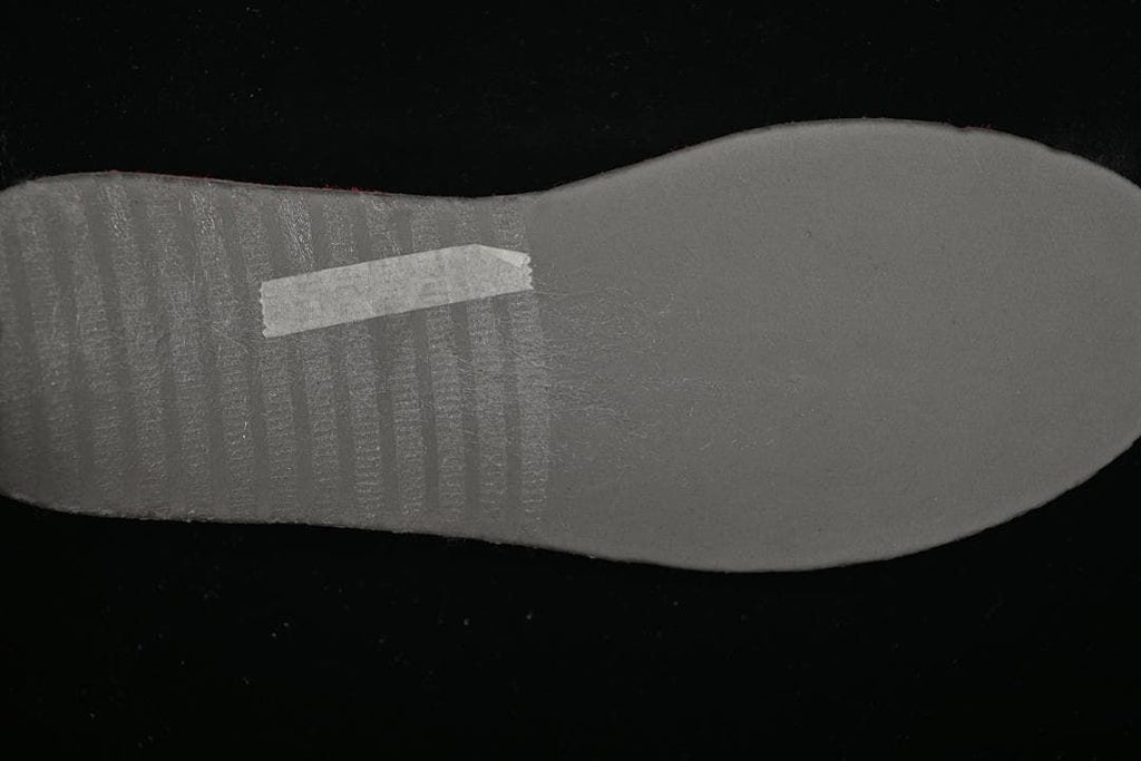 Gray outsole shown from below.