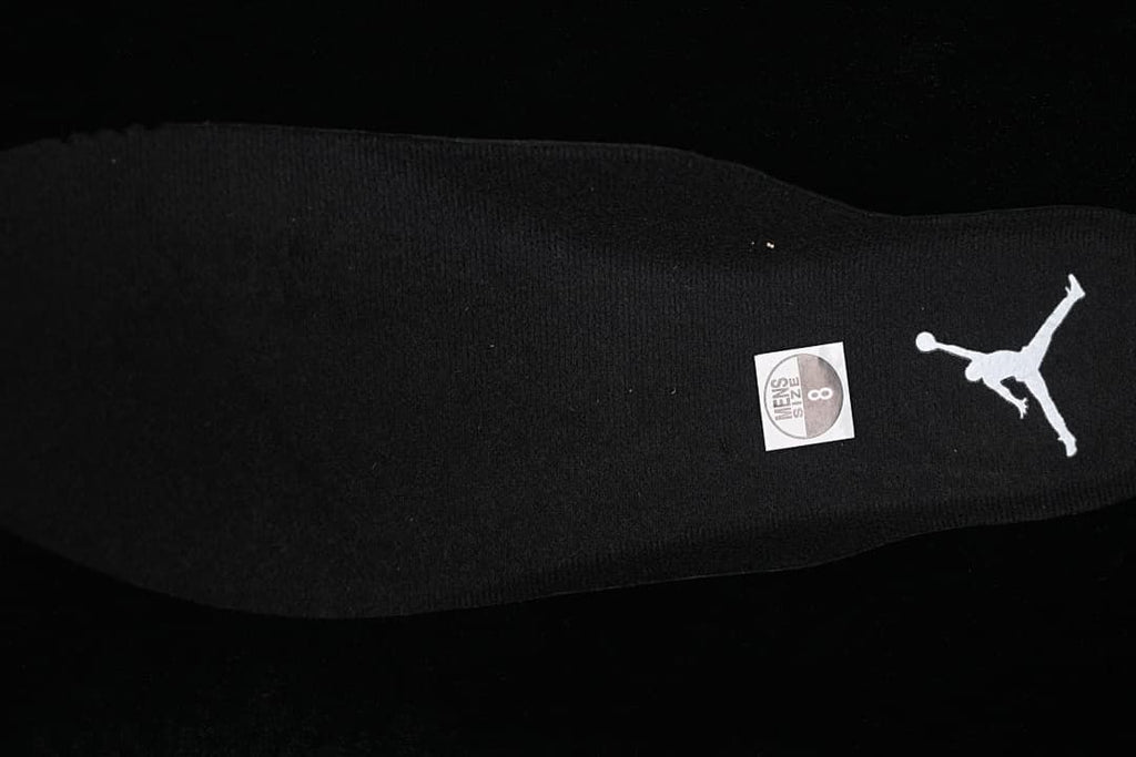 Black insole with Jordan branding and a visible size sticker