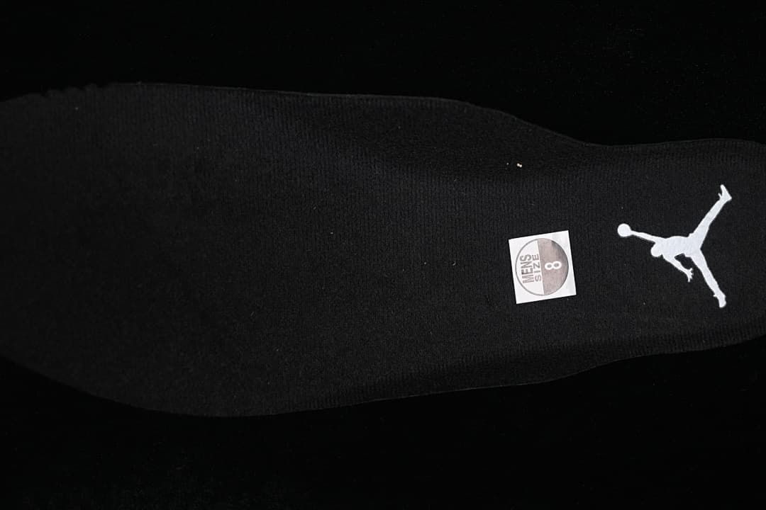 Black insole with Jordan branding and a visible size sticker