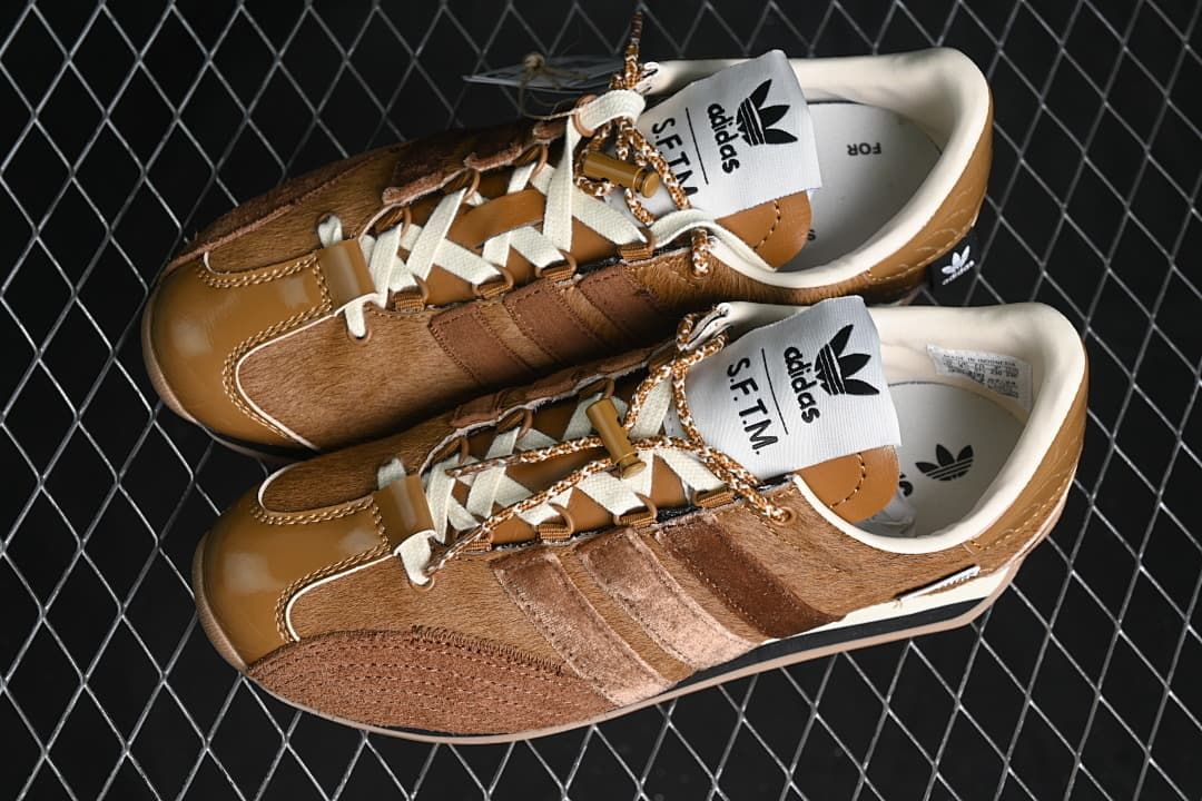 Pair of brown and cream adidas Country OG SFTM sneakers