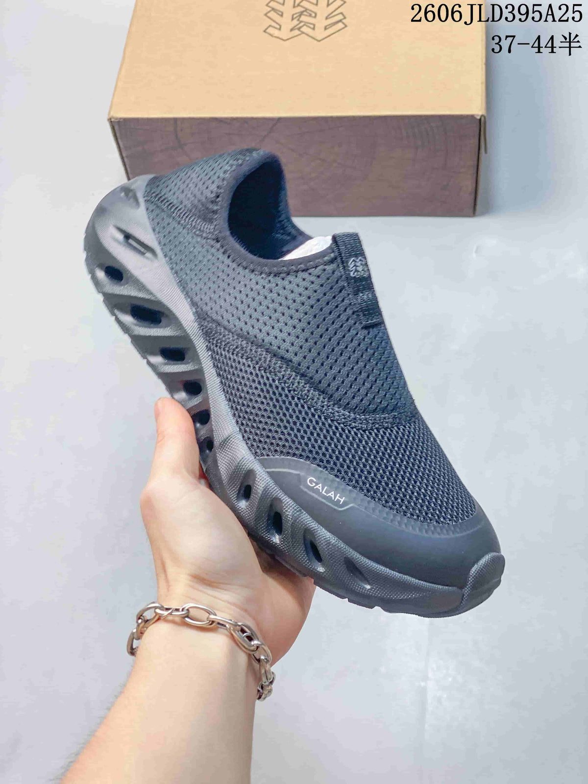 Close view of a dark gray KOLON SPORT Galah slip-on shoe with a sculpted sole; image overlay lists sizes 37–44.5.
