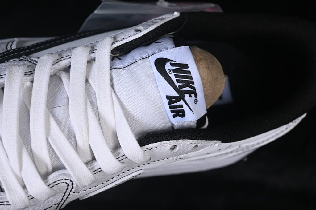 Close-up of the tongue label and white laces.