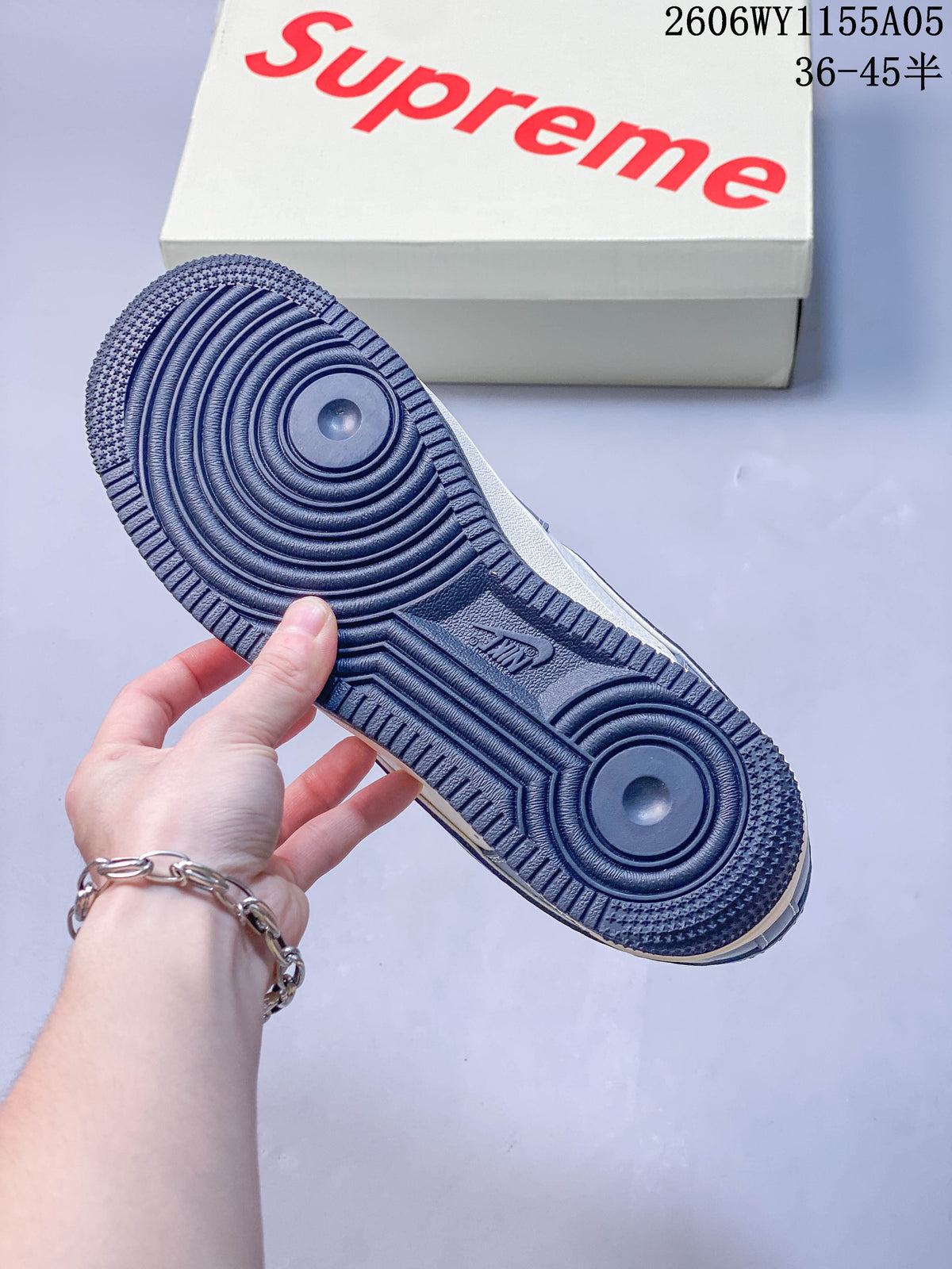 Close-up of the sneaker’s dark blue circular-pattern outsole.