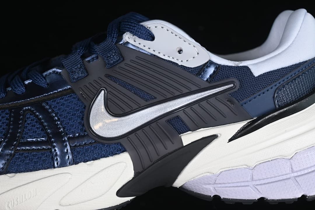 Close-up of the side Swoosh and layered upper