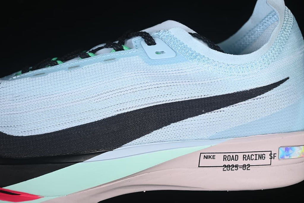Close-up of black Swoosh and colored midsole accents