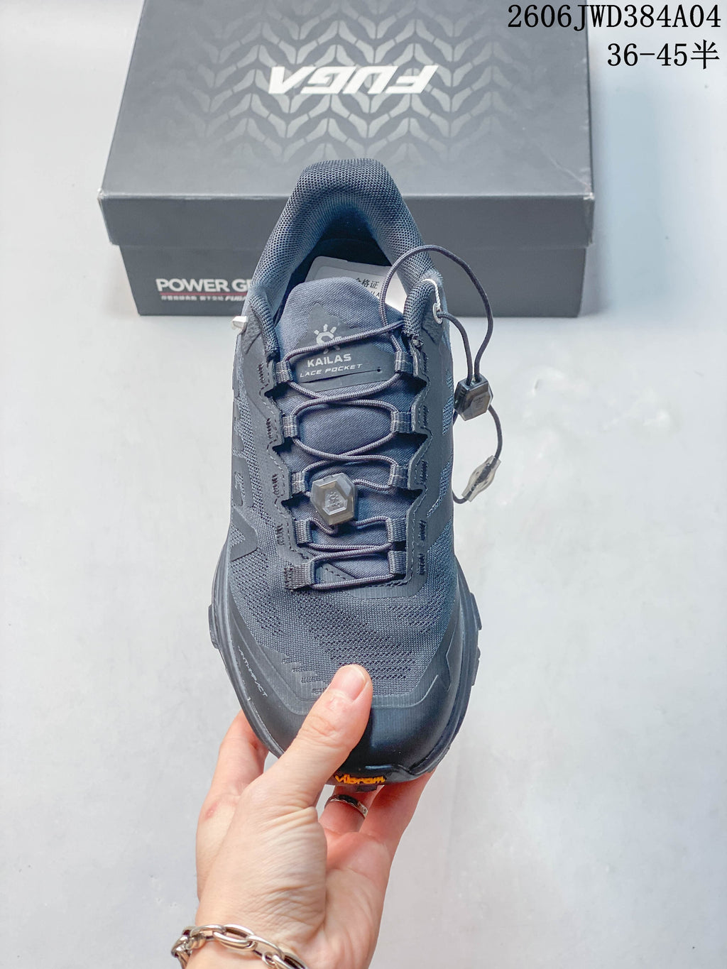 Top view of the shoe showing the dial-adjust lacing system