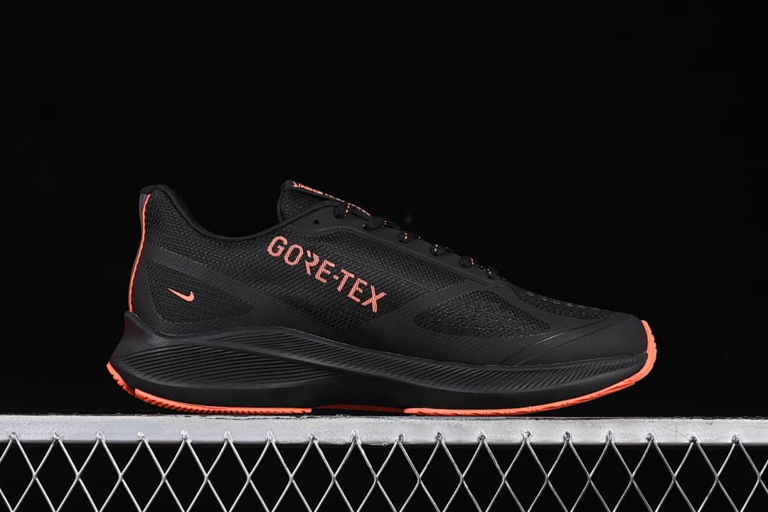 Side view showing GORE-TEX branding on the black upper.