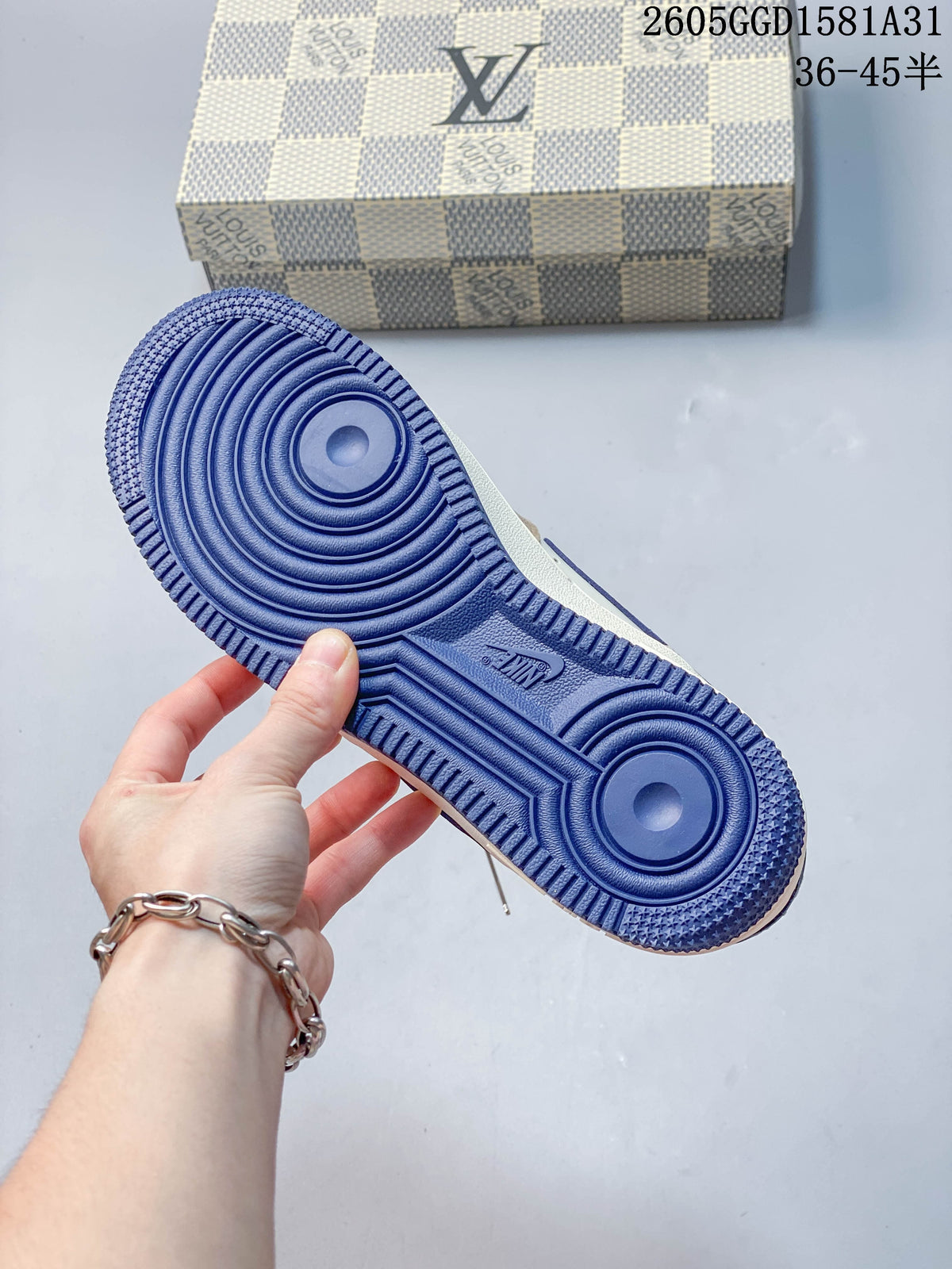 Blue outsole with circular tread on a low-top sneaker