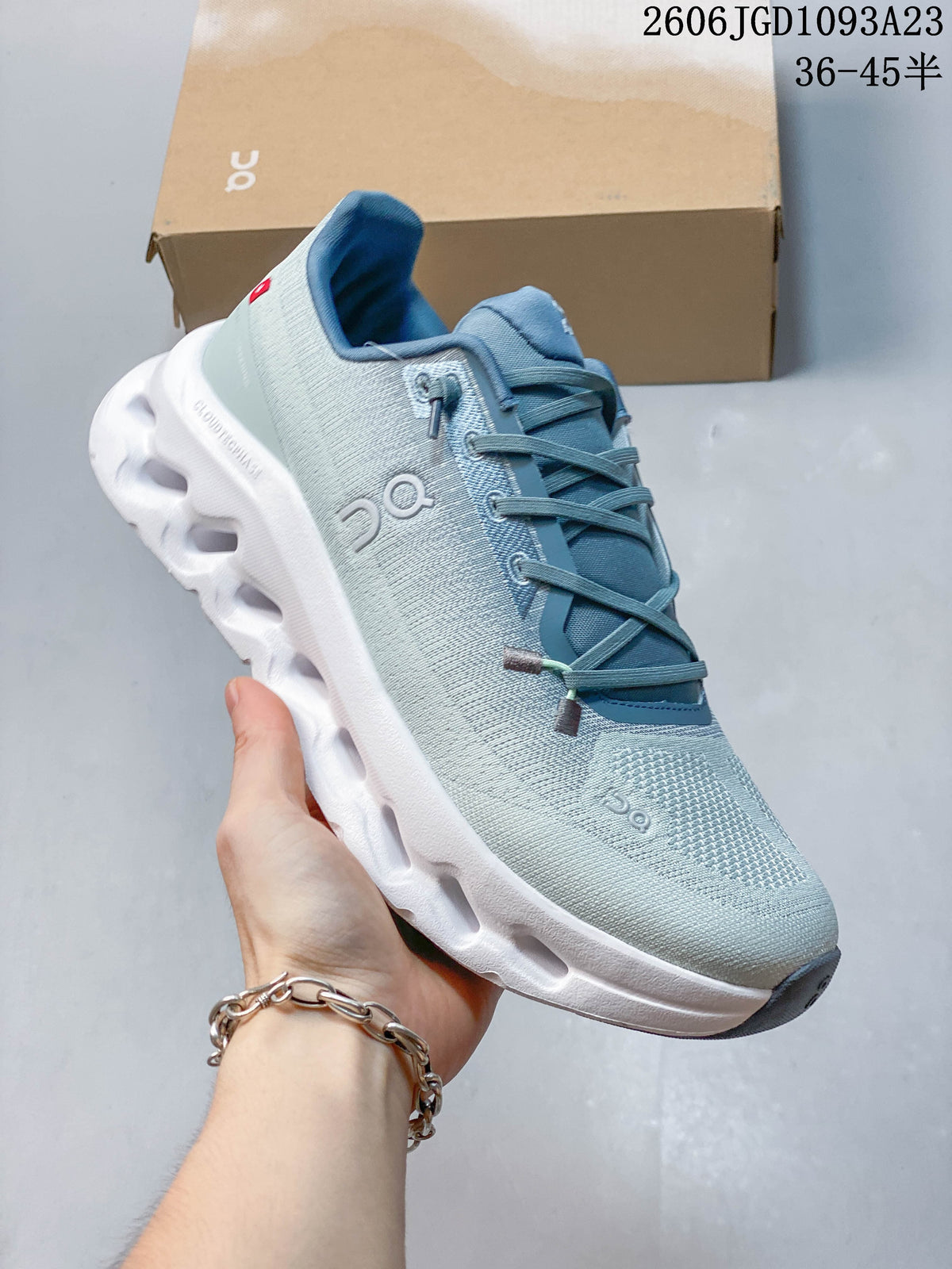 Angled close-up of the sneaker’s side, laces and sole