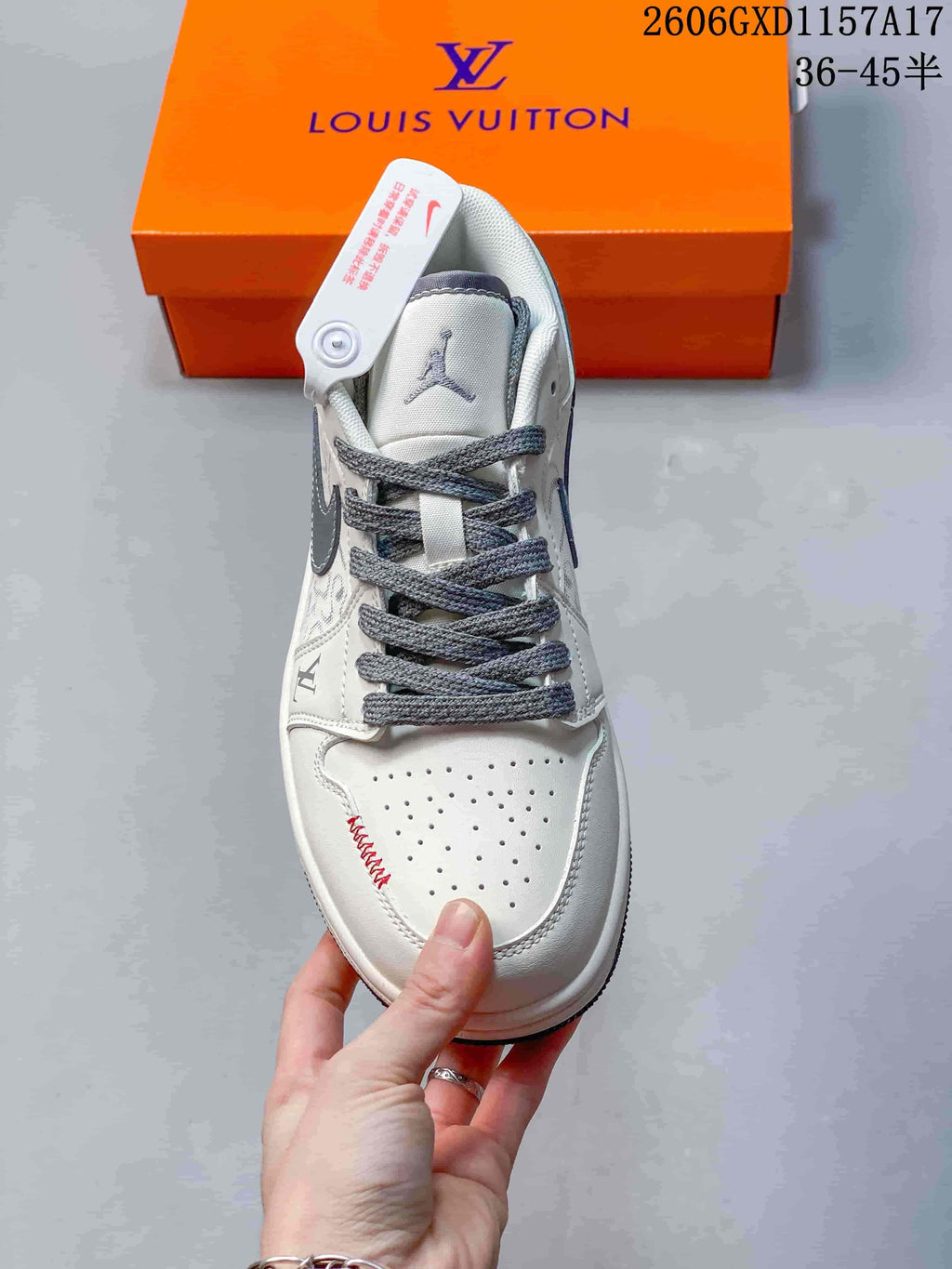 Top view showing the perforated toe, grey laces, and red stitching