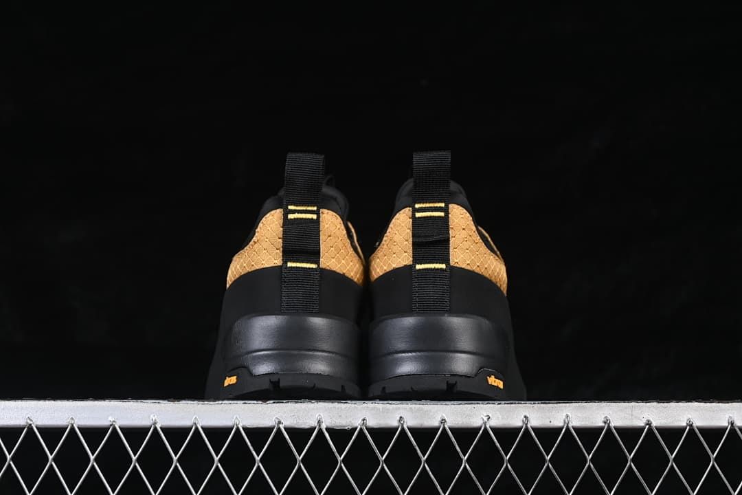 Rear view of the pair showing heel pull tabs and soles