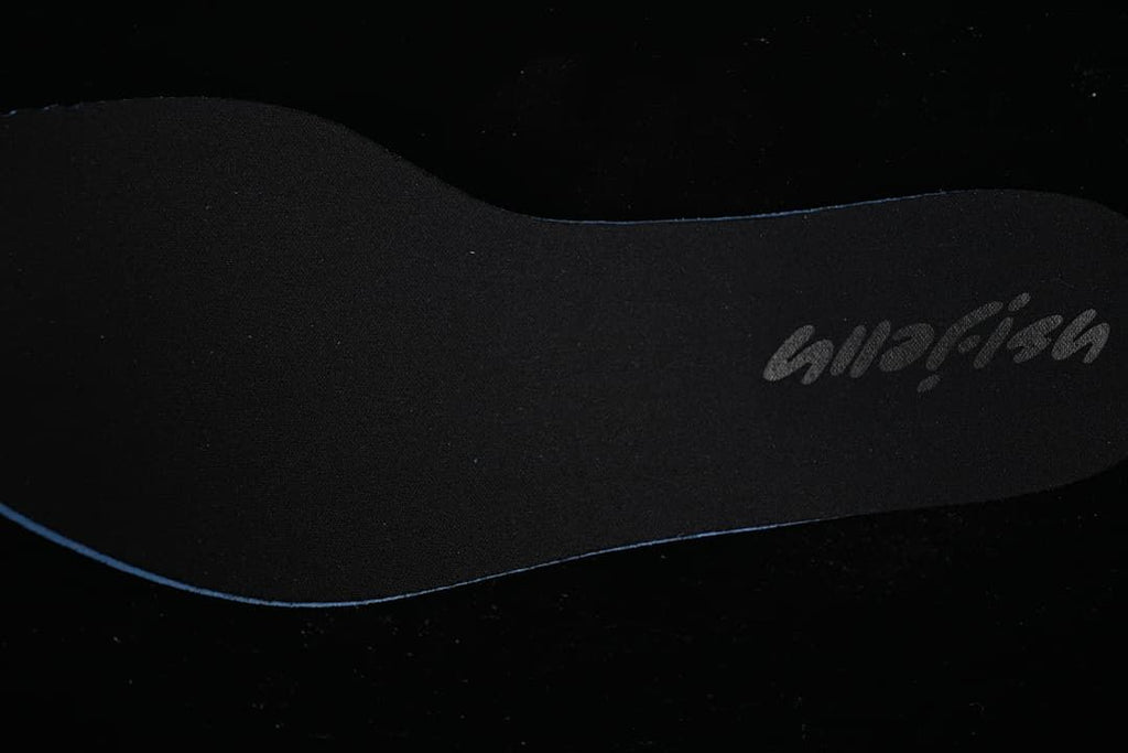 Close-up of a dark insole with Jellyfish branding.