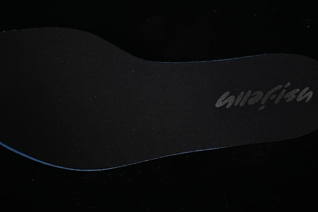 Close-up of a dark insole with Jellyfish branding.