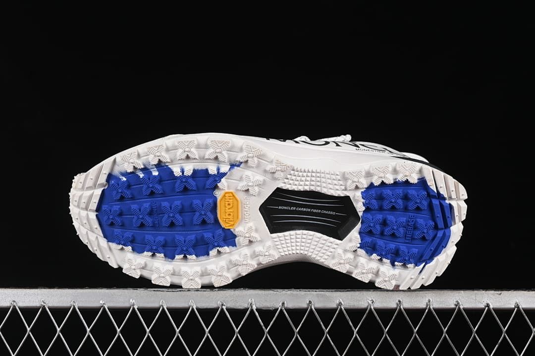 Underside showing blue and white lugged outsole sections