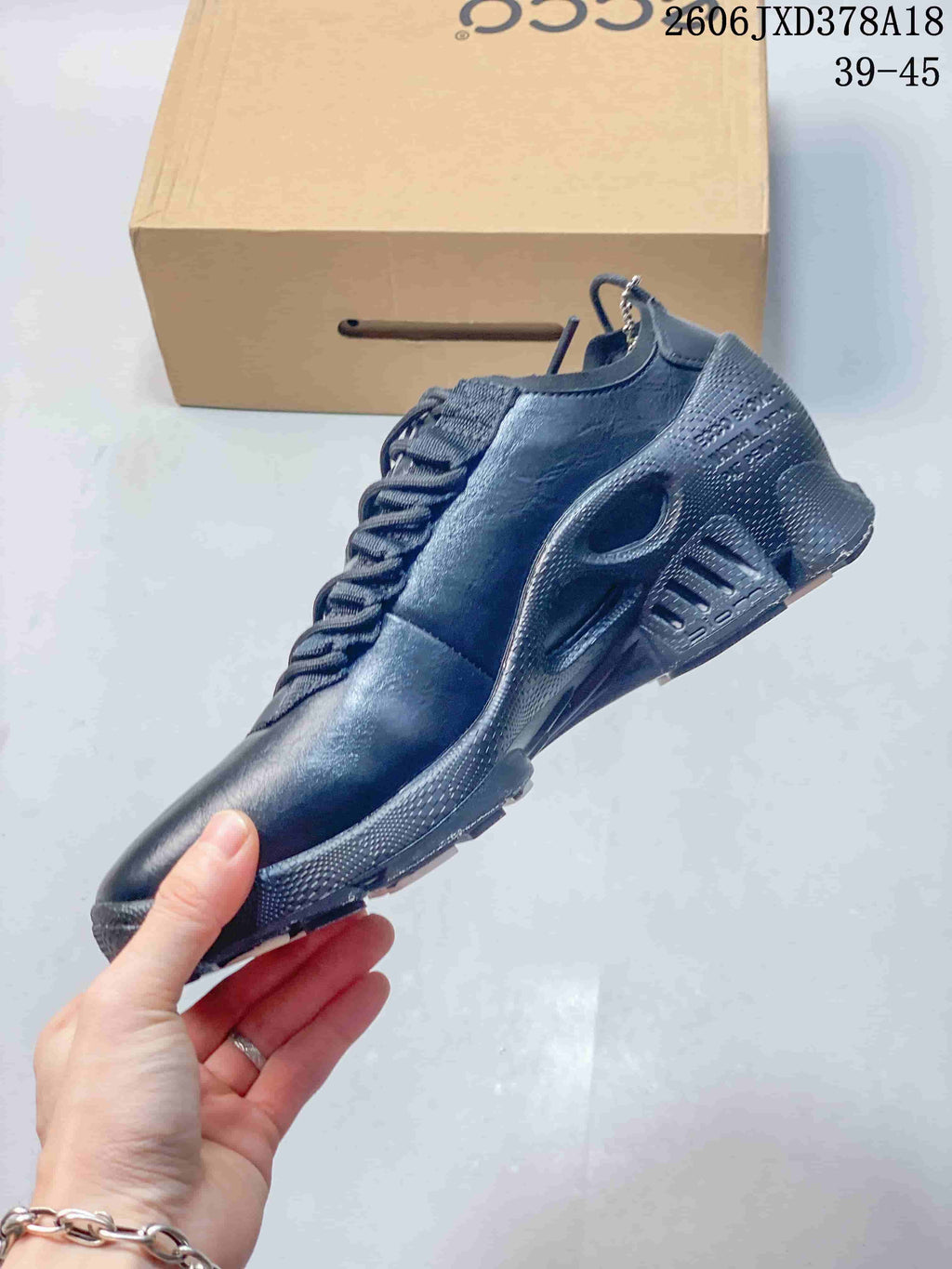 Side profile of a black ECCO BIOM sneaker