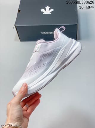 Side profile of a pale purple and white Descente sneaker