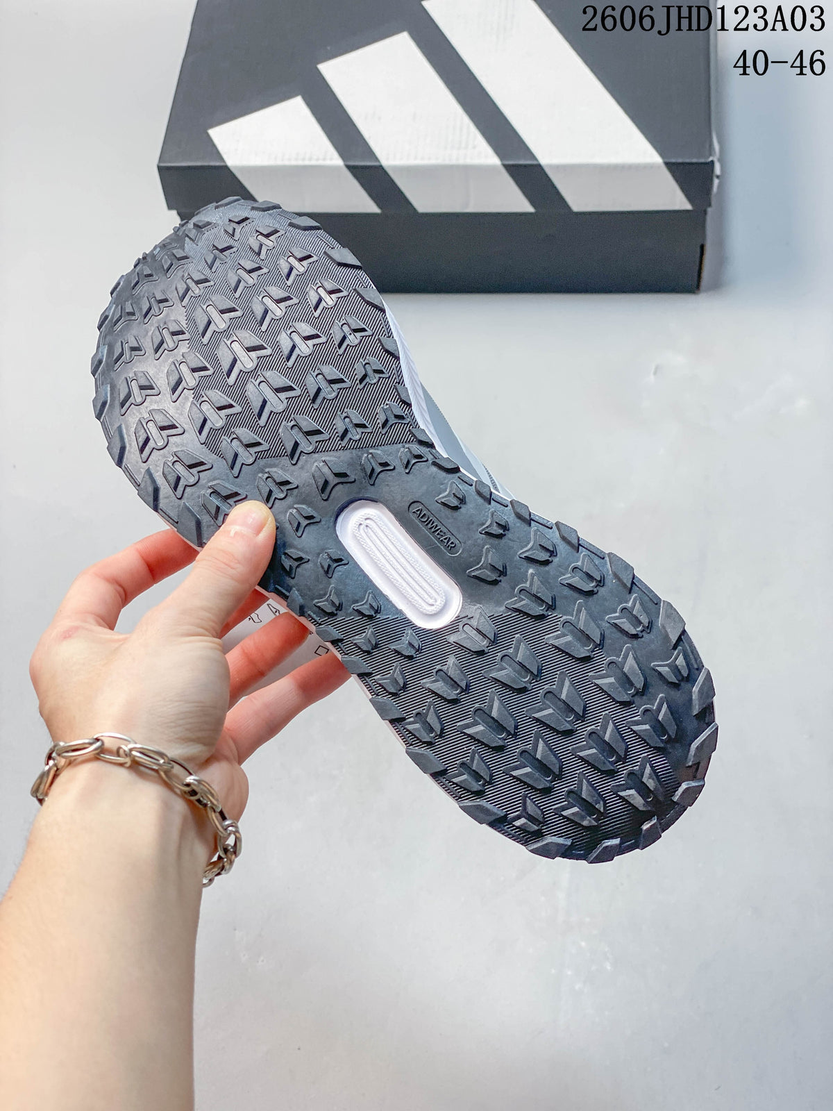 Close-up of the patterned outsole on a grey Adidas Runfalcon 5 TR shoe