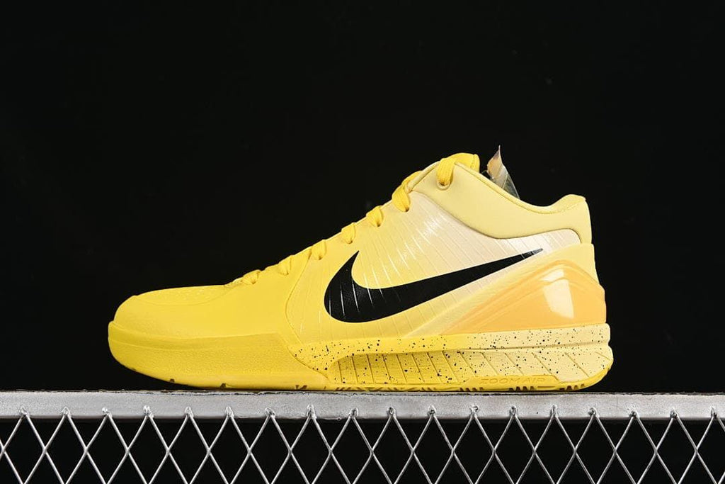 Side profile of the yellow shoe with black Swoosh