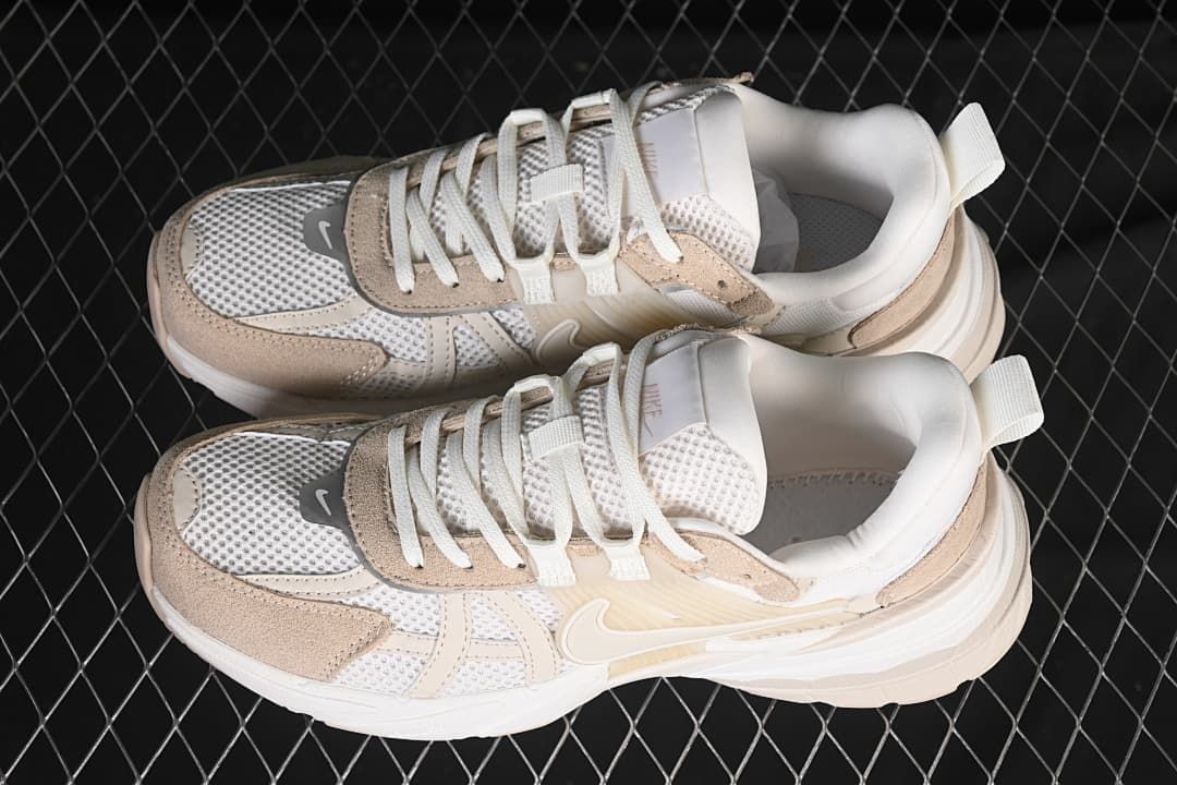 Pair of white and beige sneakers viewed from above