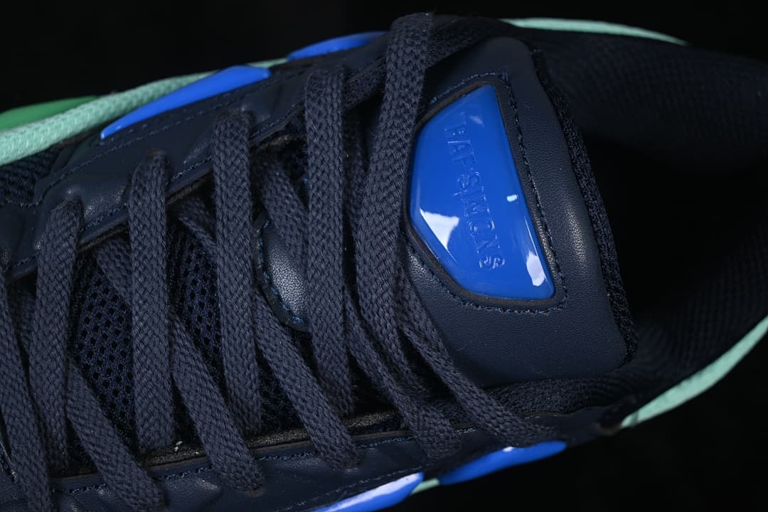Close-up of navy laces and blue tongue accent