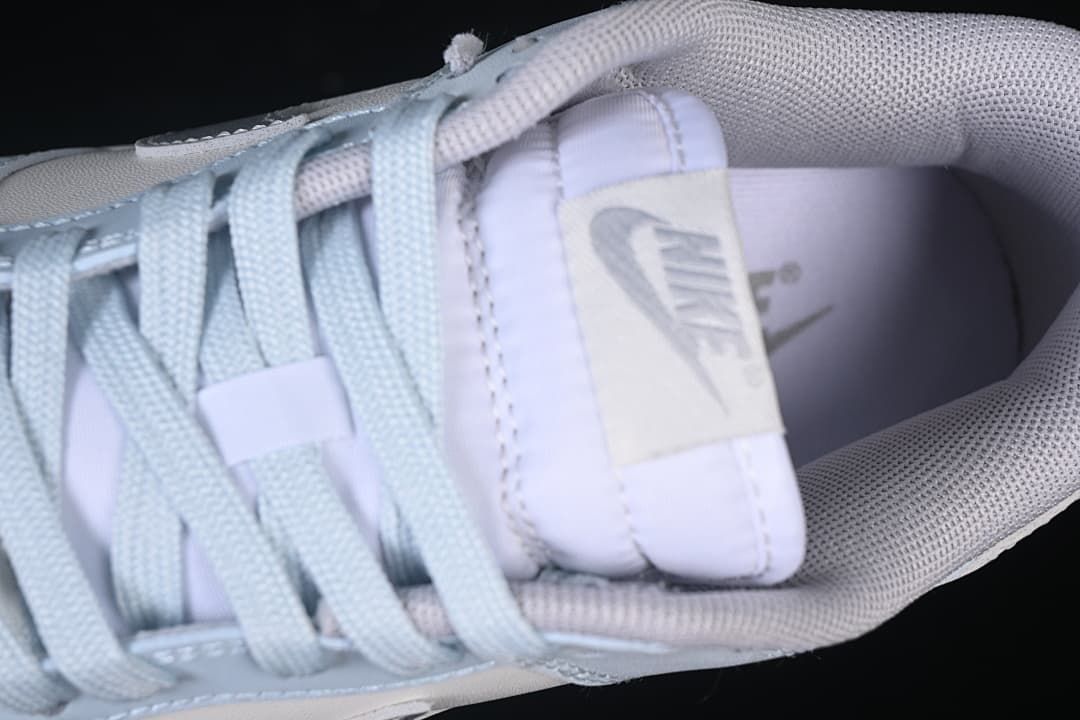 Close-up of tongue label, laces, and padded collar