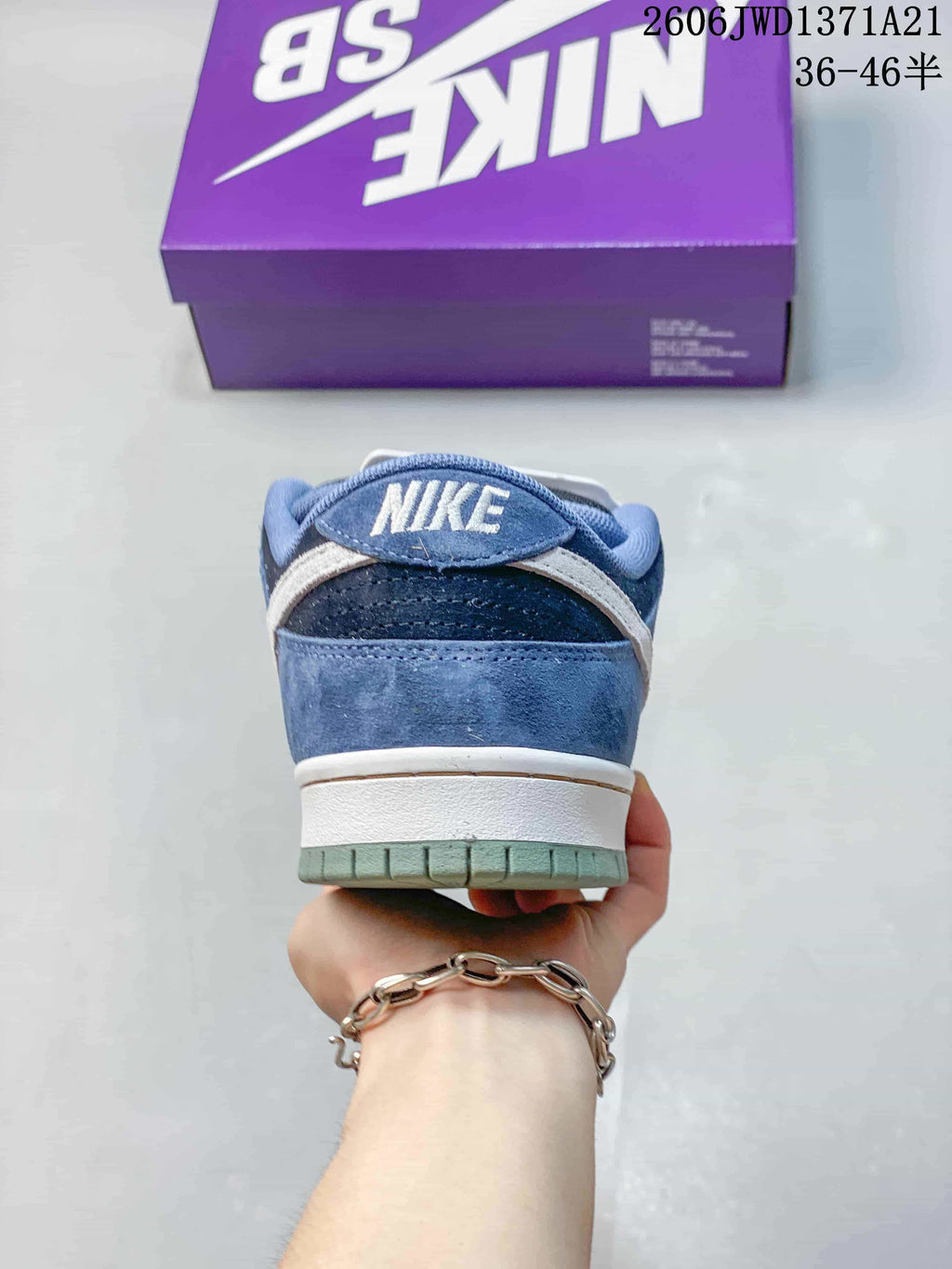 Rear view showing the heel and outsole of a blue Nike SB Dunk Low Pro sneaker.