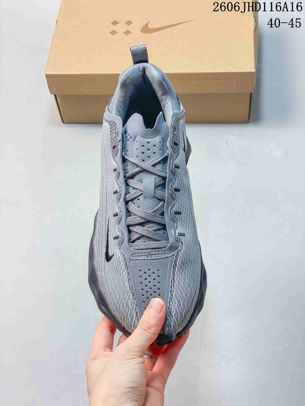 Top view of the laces and perforated details on a gray Nike Ava Rover Hs shoe