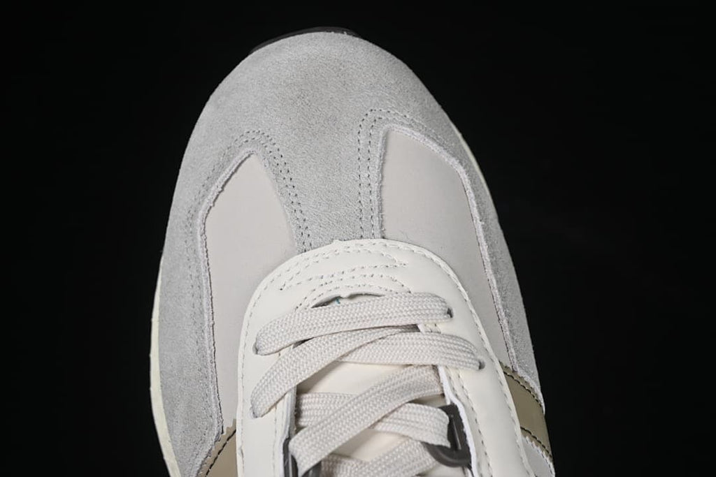 Top-down detail of the grey toe and lace-up front